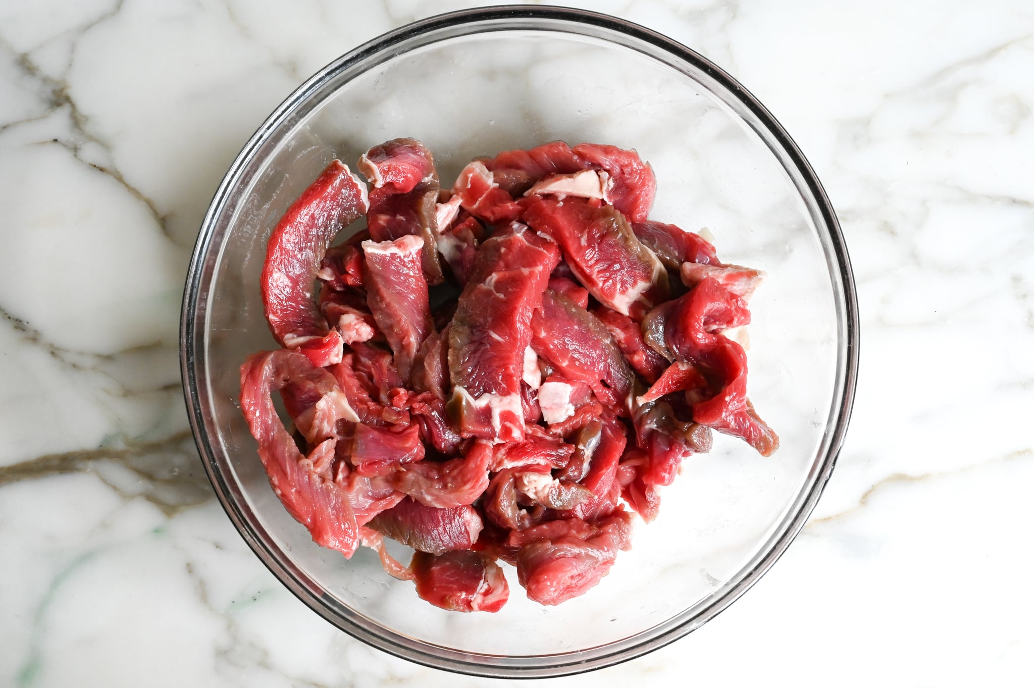 Sliced meat in baking soda solution.