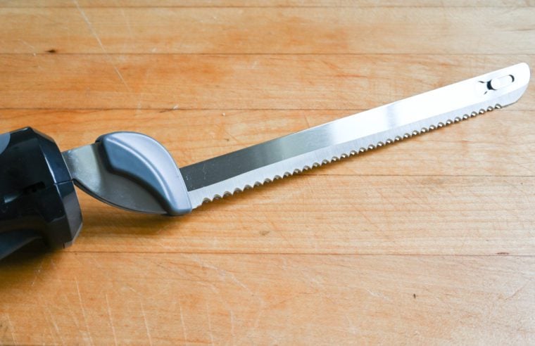 Carving knife on a wooden cutting board.