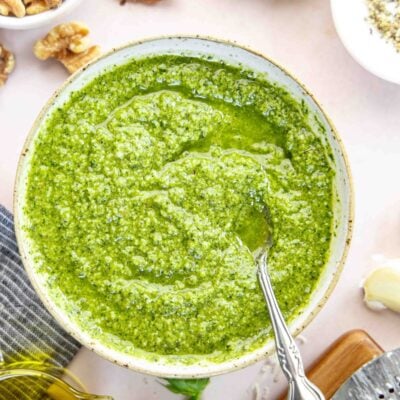 pesto sauce in bowl with linen napkin