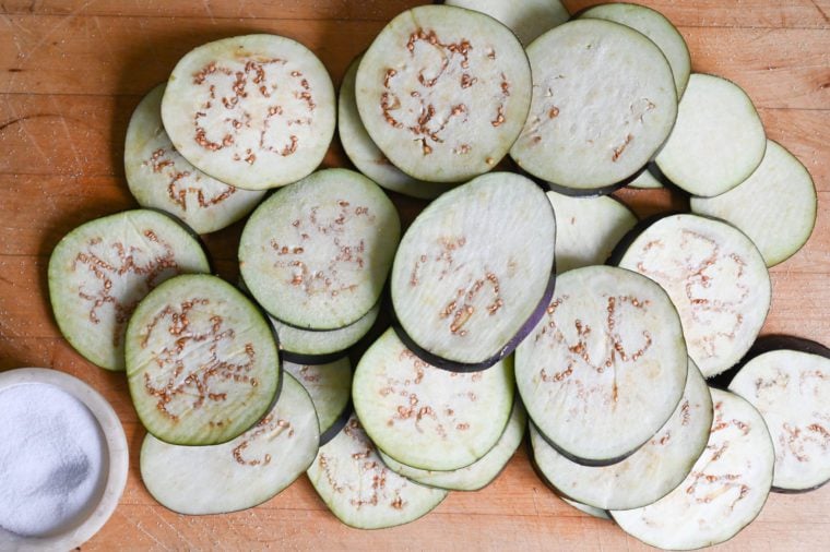 salting eggplants on cutting board