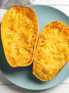 Halved and shredded spaghetti squash.