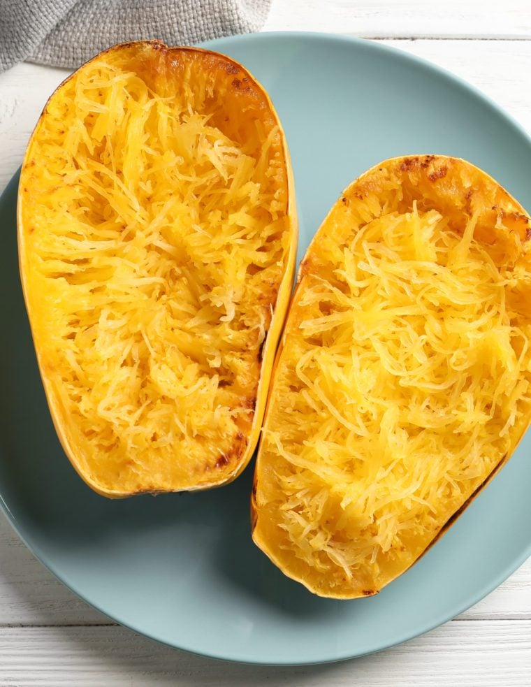 Halved and shredded spaghetti squash.