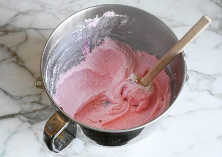 pressing the macaron batter against the sides and bottom of the bowl to release air bubbles (macronage)