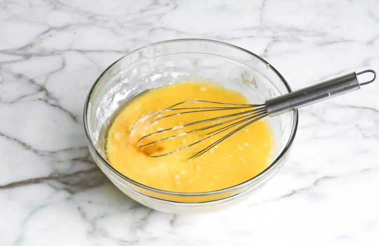 adding melted butter, honey, and vanilla