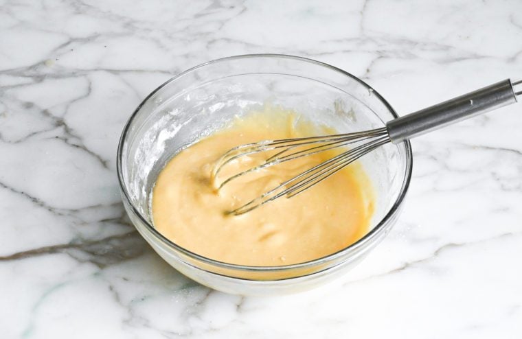 eggs and dry ingredients whisked in a bowl