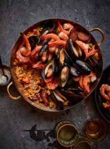 Spanish paella in beautiful copper paella pan.