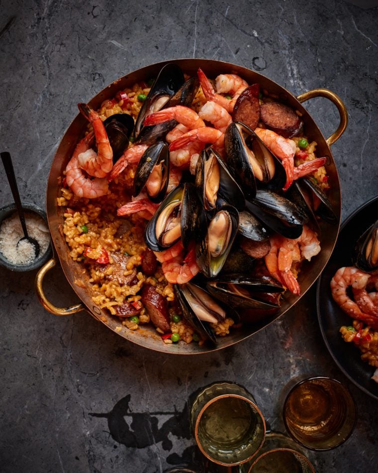 Spanish paella in beautiful copper paella pan.