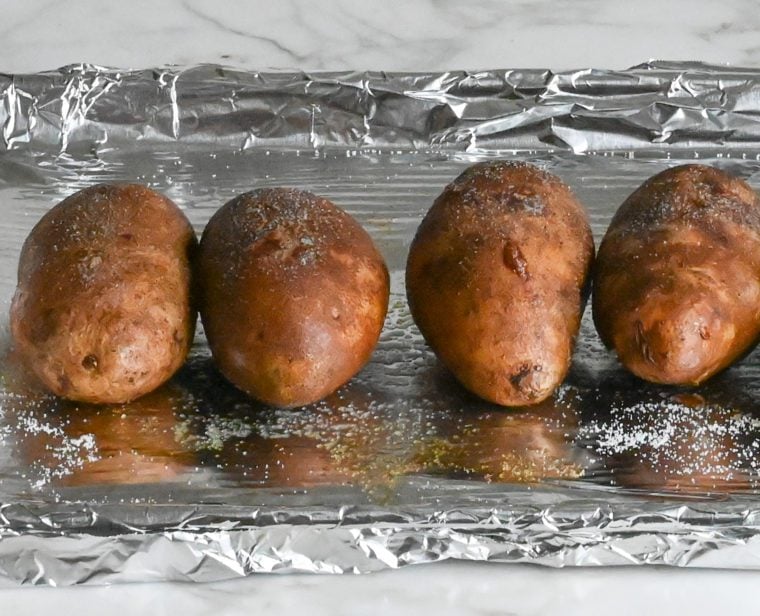 potatoes rubbed with oil and seasoned with salt
