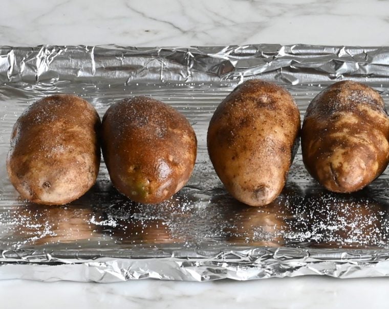 potatoes rubbed with oil and seasoned with salt