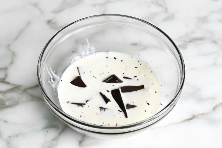 hot cream, corn syrup, and chocolate in bowl