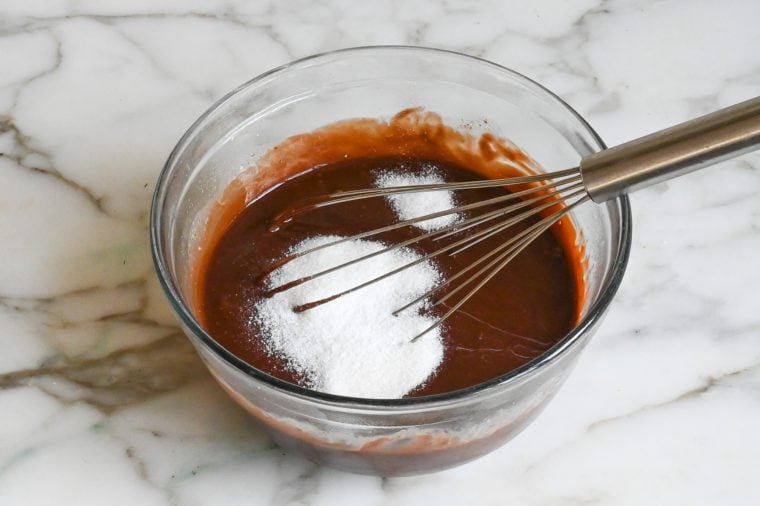 adding the sugar and salt to the chocolate mixture