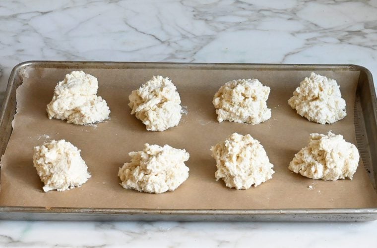 raw brod biscuits on baking sheet