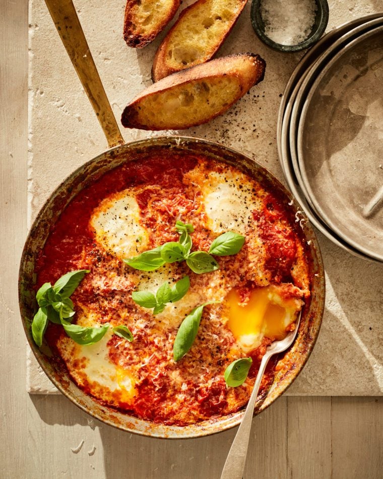 Spoon in a pot of food.