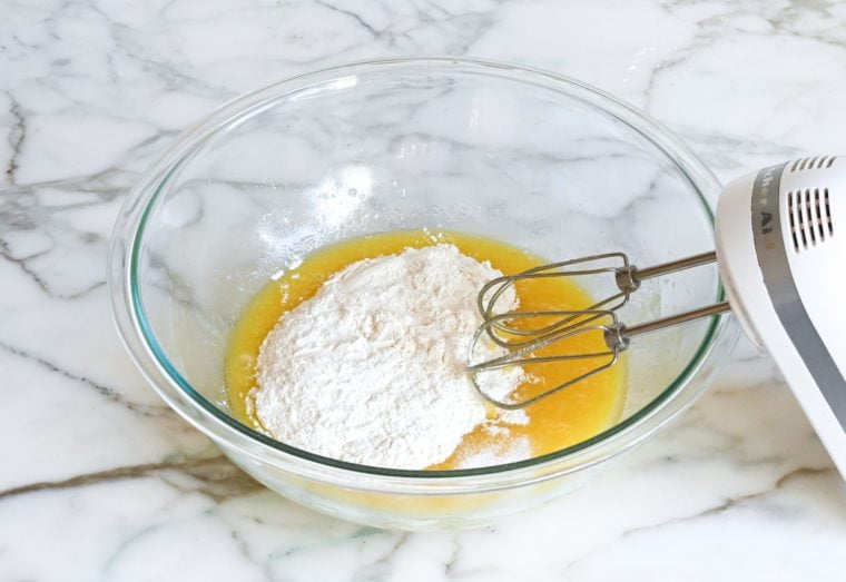 adding the flour and salt to the batter