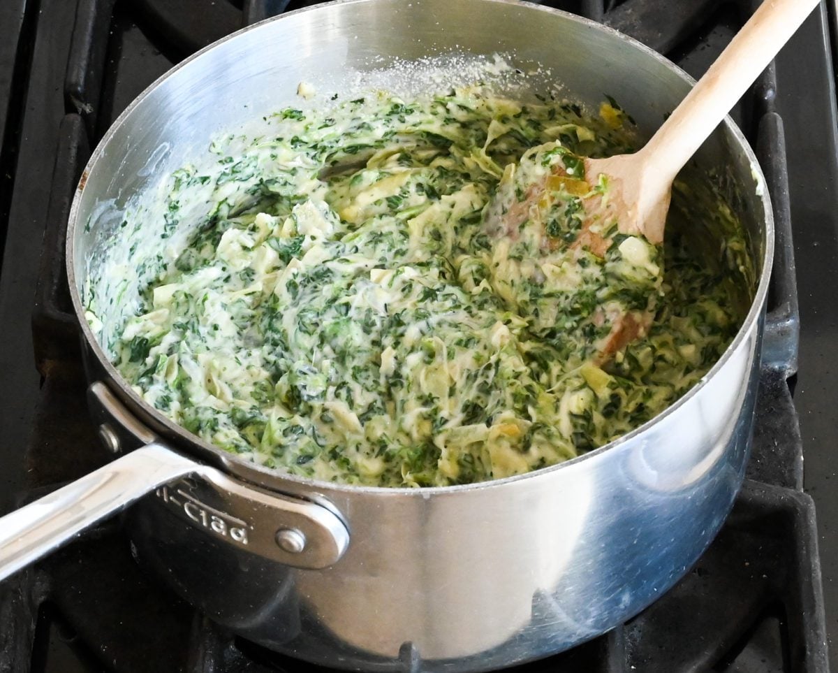 spinach artichoke dip in pot.