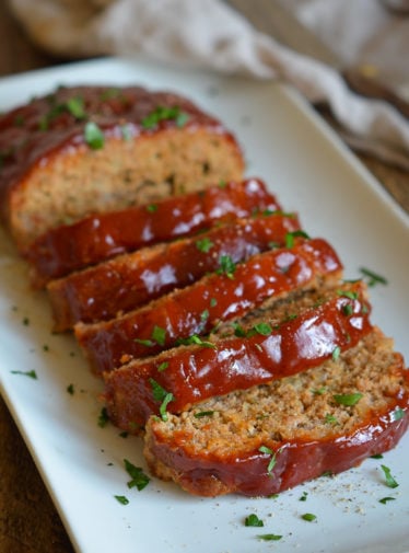 Platter of sliced turkey meatloaf.