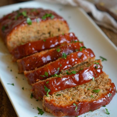 Platter of sliced turkey meatloaf.