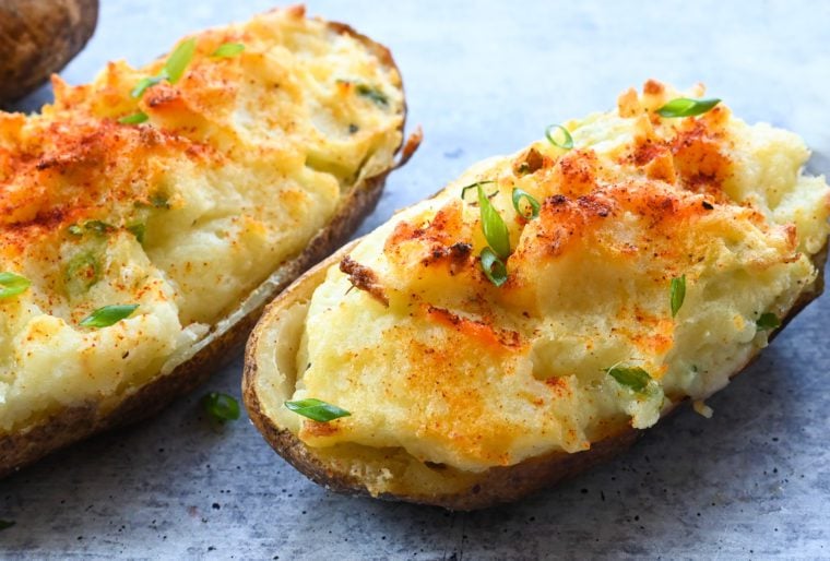 Twice baked potatoes on parchment paper.