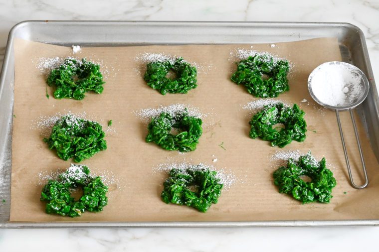 dusting the wreaths with powdered sugar
