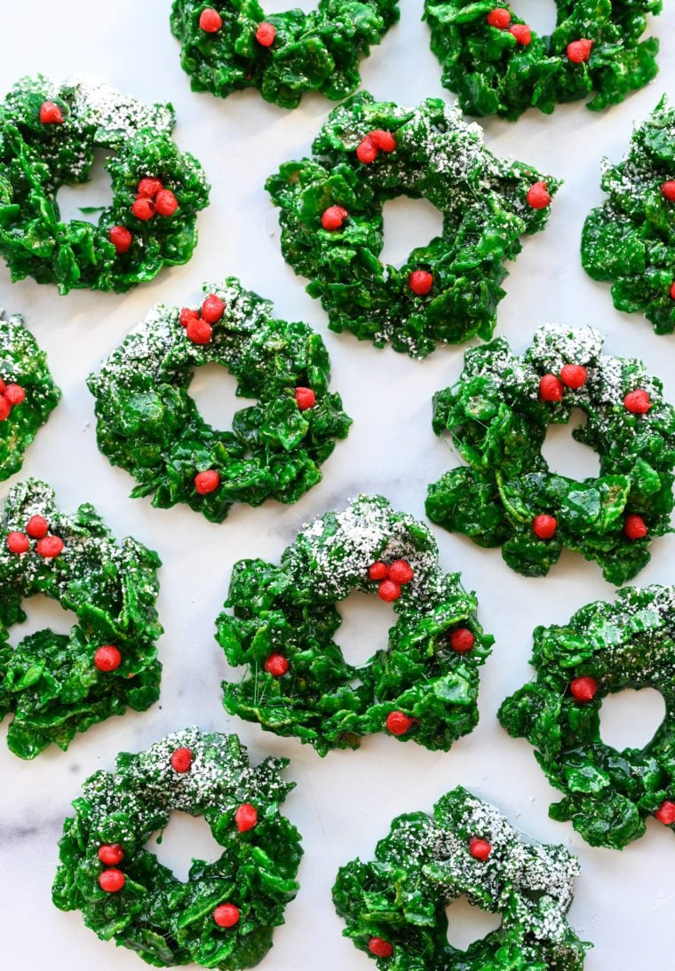 Christmas wreath cookies on marble board.