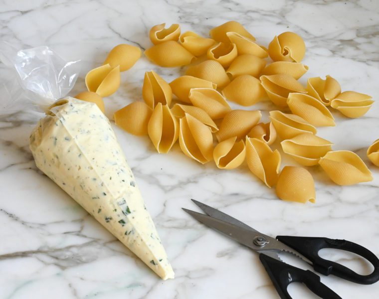 snipping off the top of the pastry bag