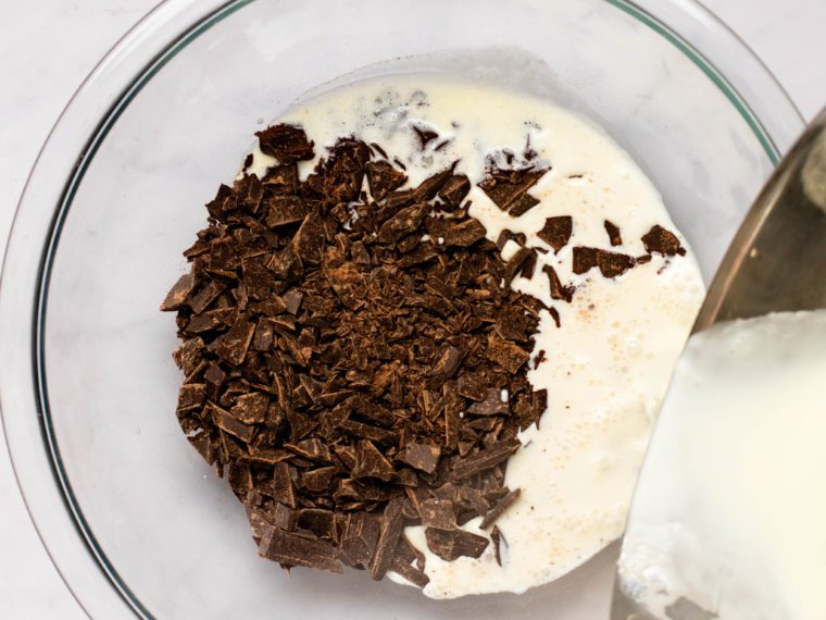 pouring hot cream over chocolate