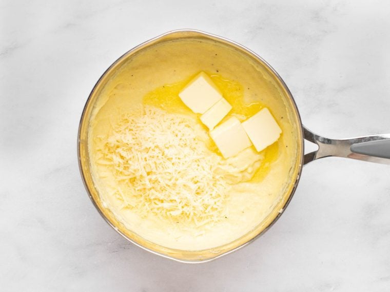 adding butter and cheese to the pan.