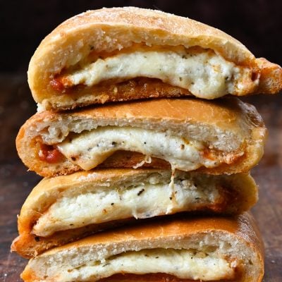 Stack of halved Calzones.