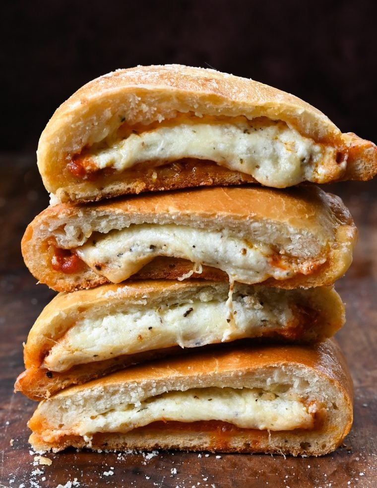 Stack of halved Calzones.