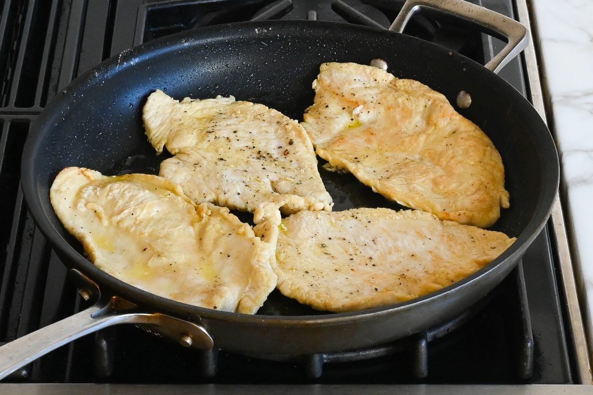 sautéing the chicken on the second side