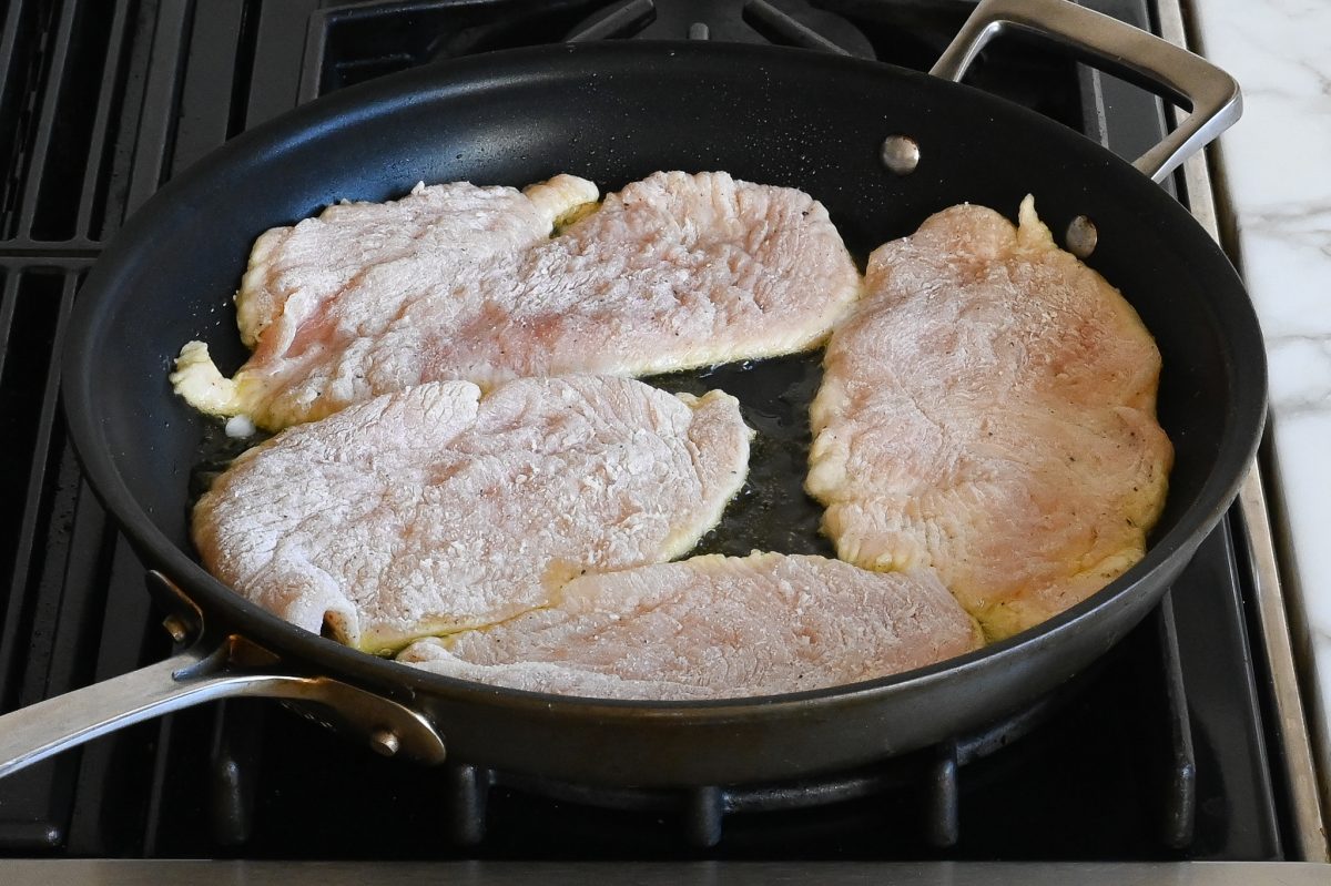 sautéing the chicken in oil