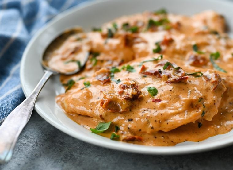Spoon on a plate of marry me chicken.