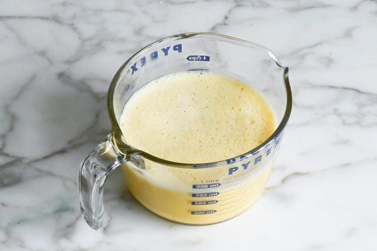 crème brûlée custard mixture in measuring cup