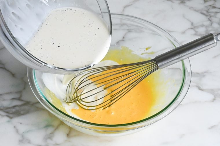 gradually whisking in the cream
