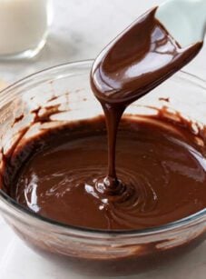 Drizzling chocolate ganache in bowl