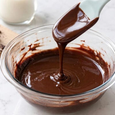 Drizzling chocolate ganache in bowl