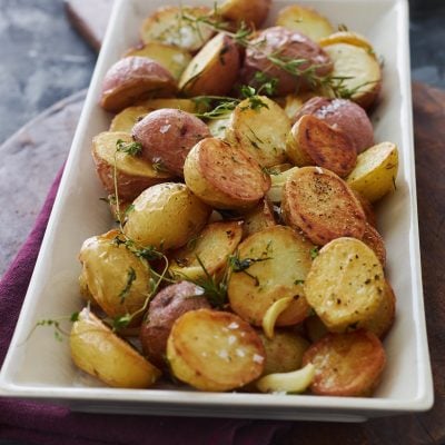 Roasted potatoes on a serving platter.