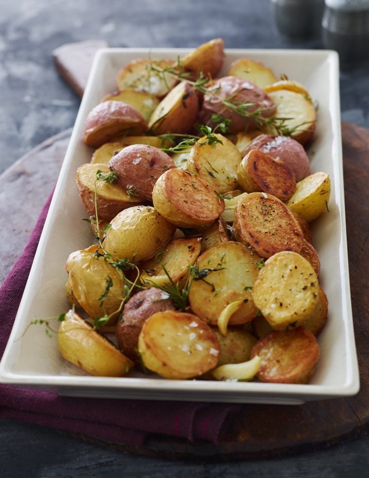 Roasted potatoes on a serving platter.