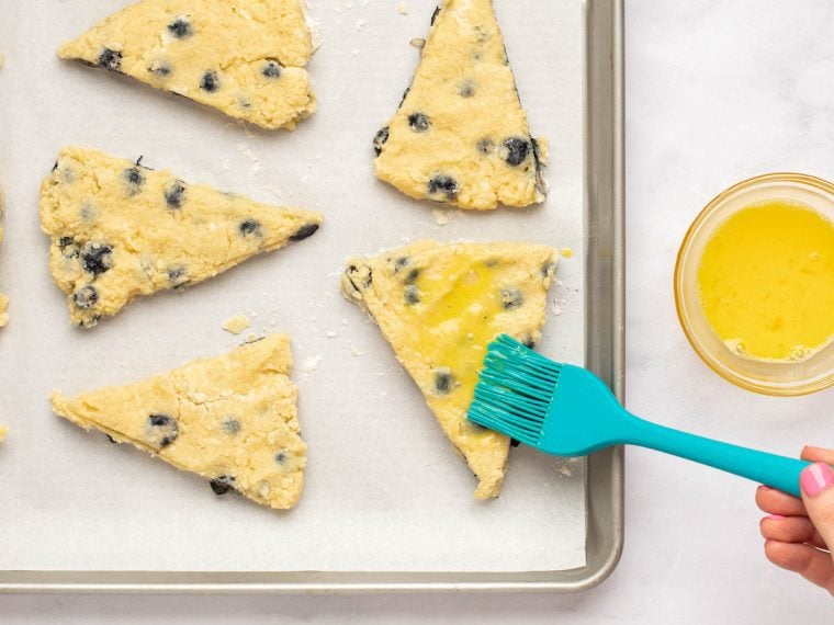 brushing the scones with egg wash