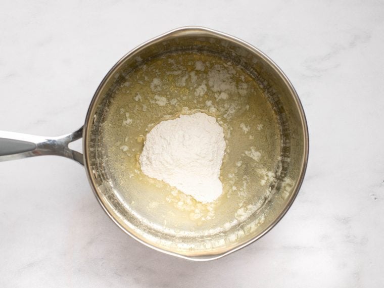 adding the flour to the melted butter