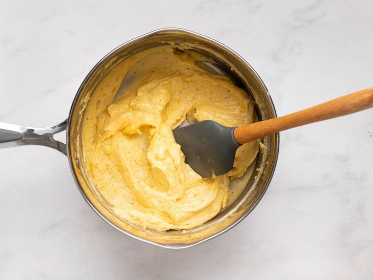Spatula in a pot of soufflé base.