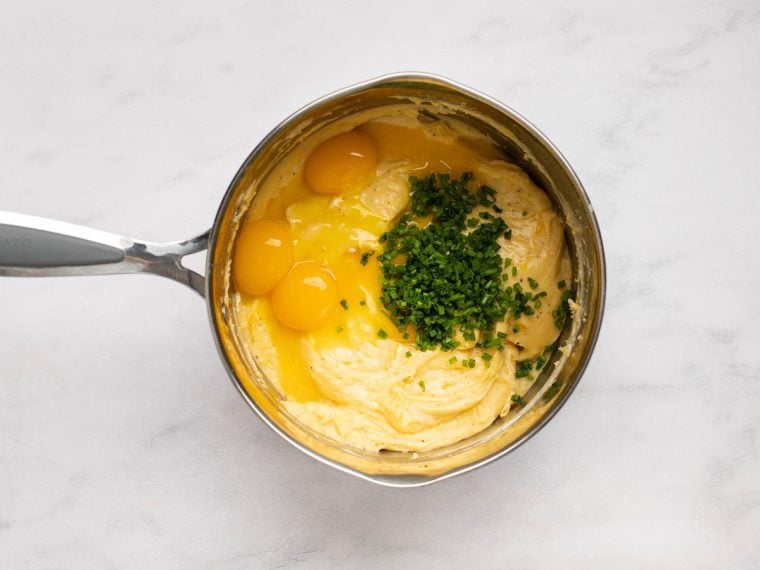 adding the yolk and chives