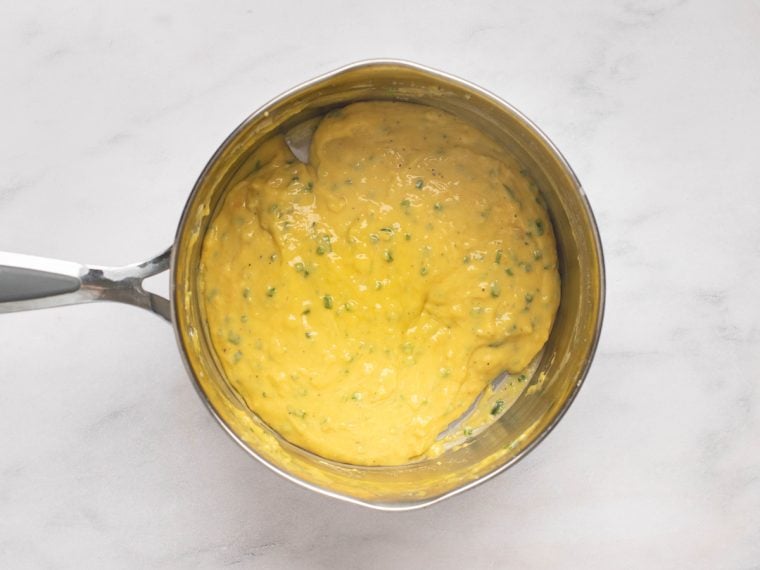 whisked soufflé base with eggs and chives