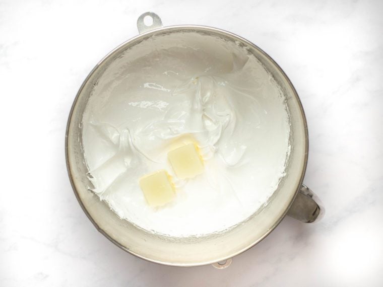 slowly adding the butter