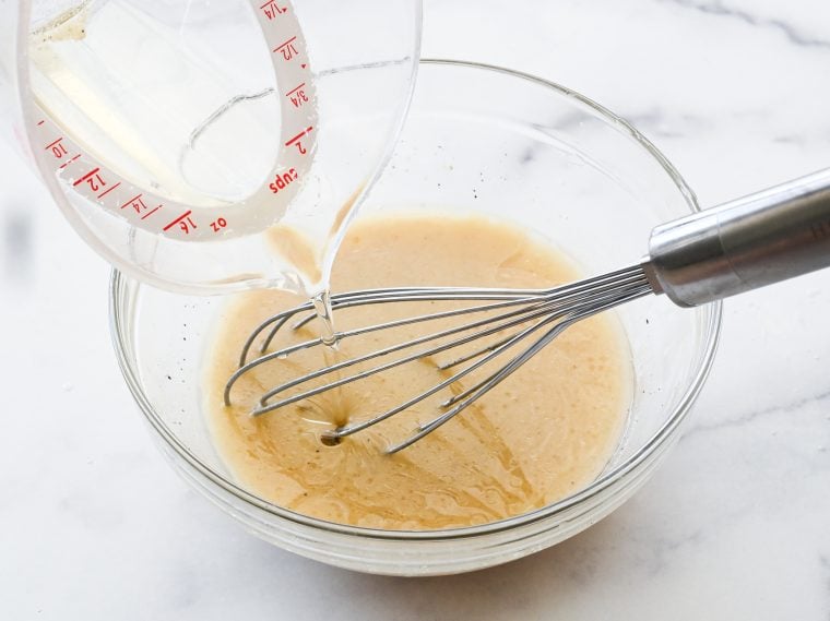 whisking in the vegetable oil