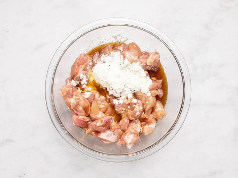 combining the chicken with the 2 tablespoons of cornstarch and 2 tablespoons of the sauce mixture