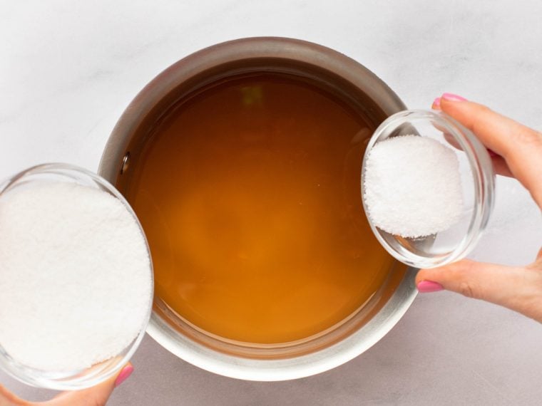 adding vinegar, sugar, and salt to saucepan