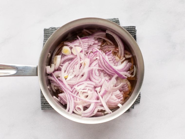 adding onions to the pan