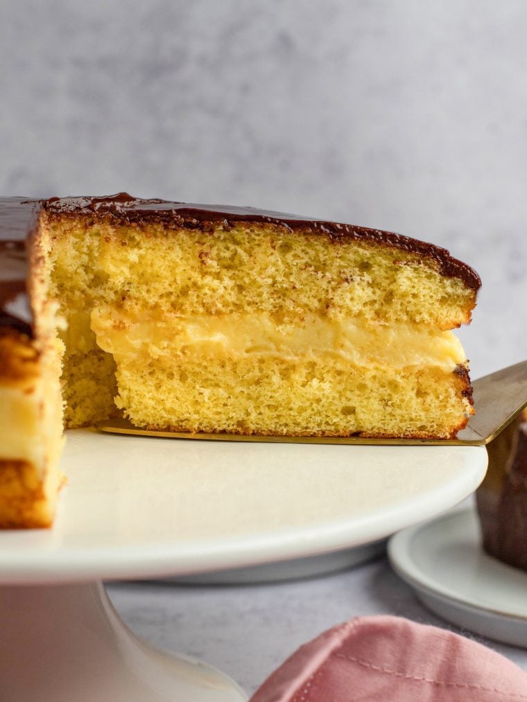 Partially-sliced Boston cream pie.