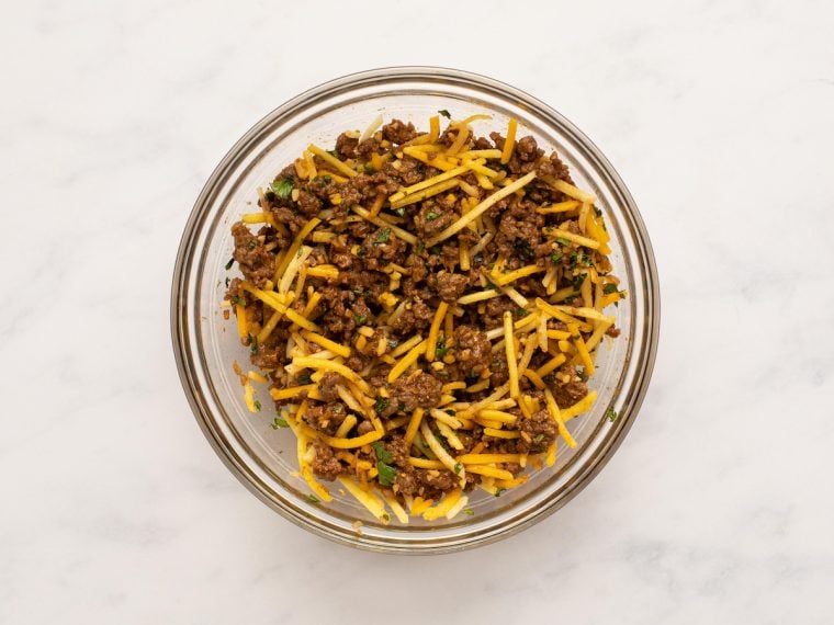 cheese and cilantro in bowl with beef